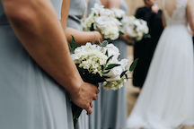 bridesmaid holding arrangement