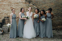 bridesmaids laughing with bride